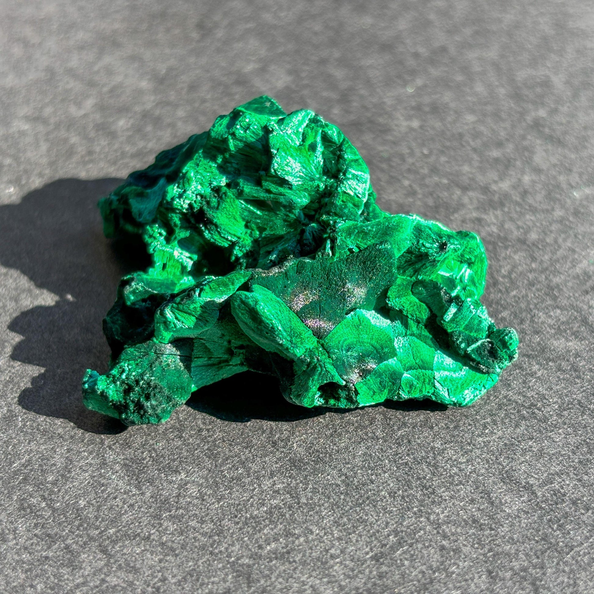 Velvet Malachite Mineral Specimen against a black background