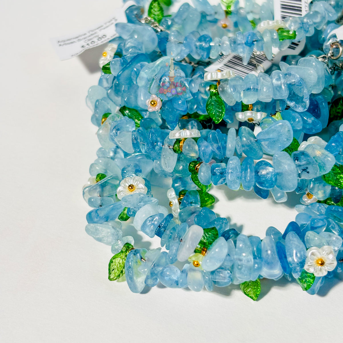 Aquamarine Flower Fairy Crystal Bracelets by From Paradise with small floral charms.