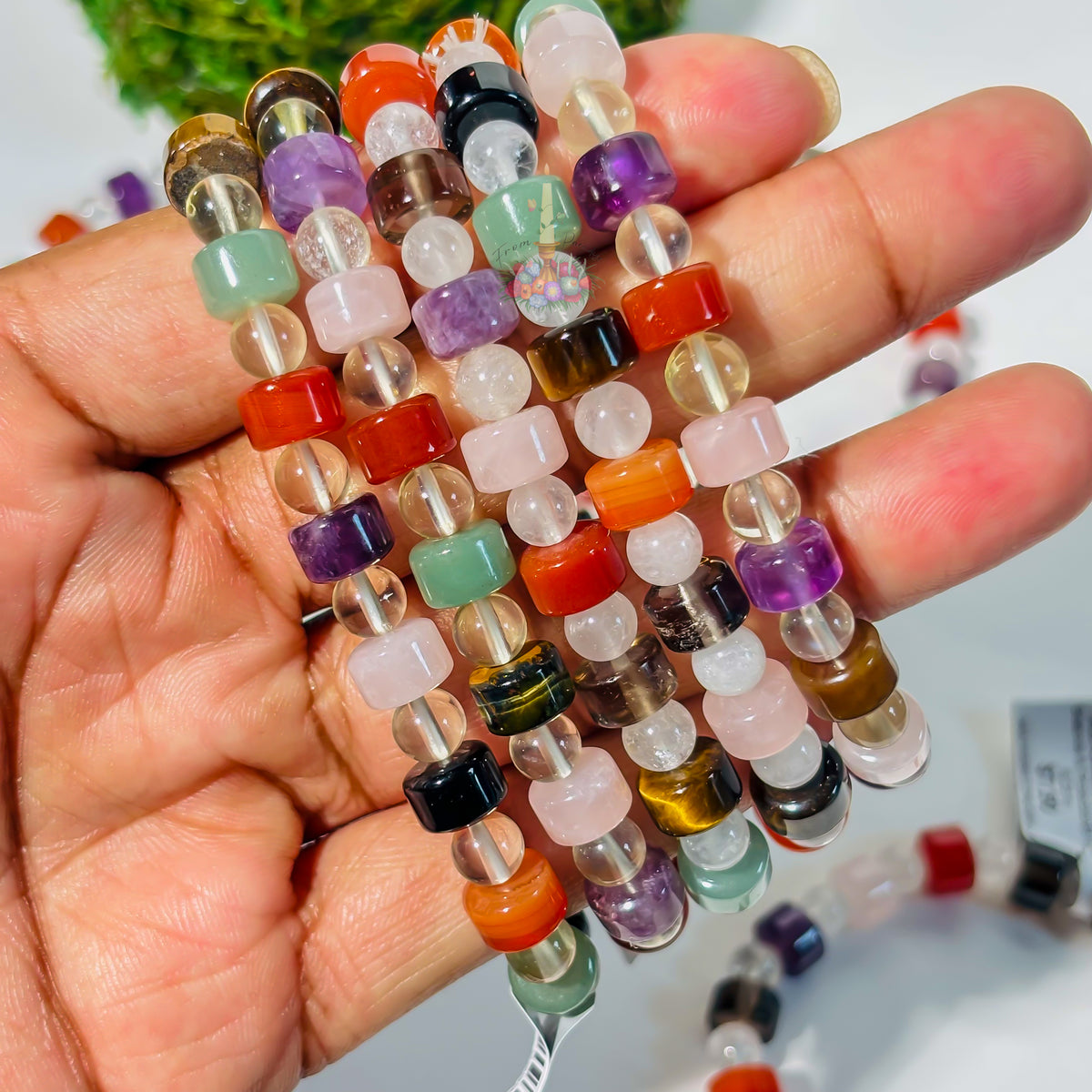 Multi-gemstone crystal bracelet featuring colorful healing stones for balance and protection.
