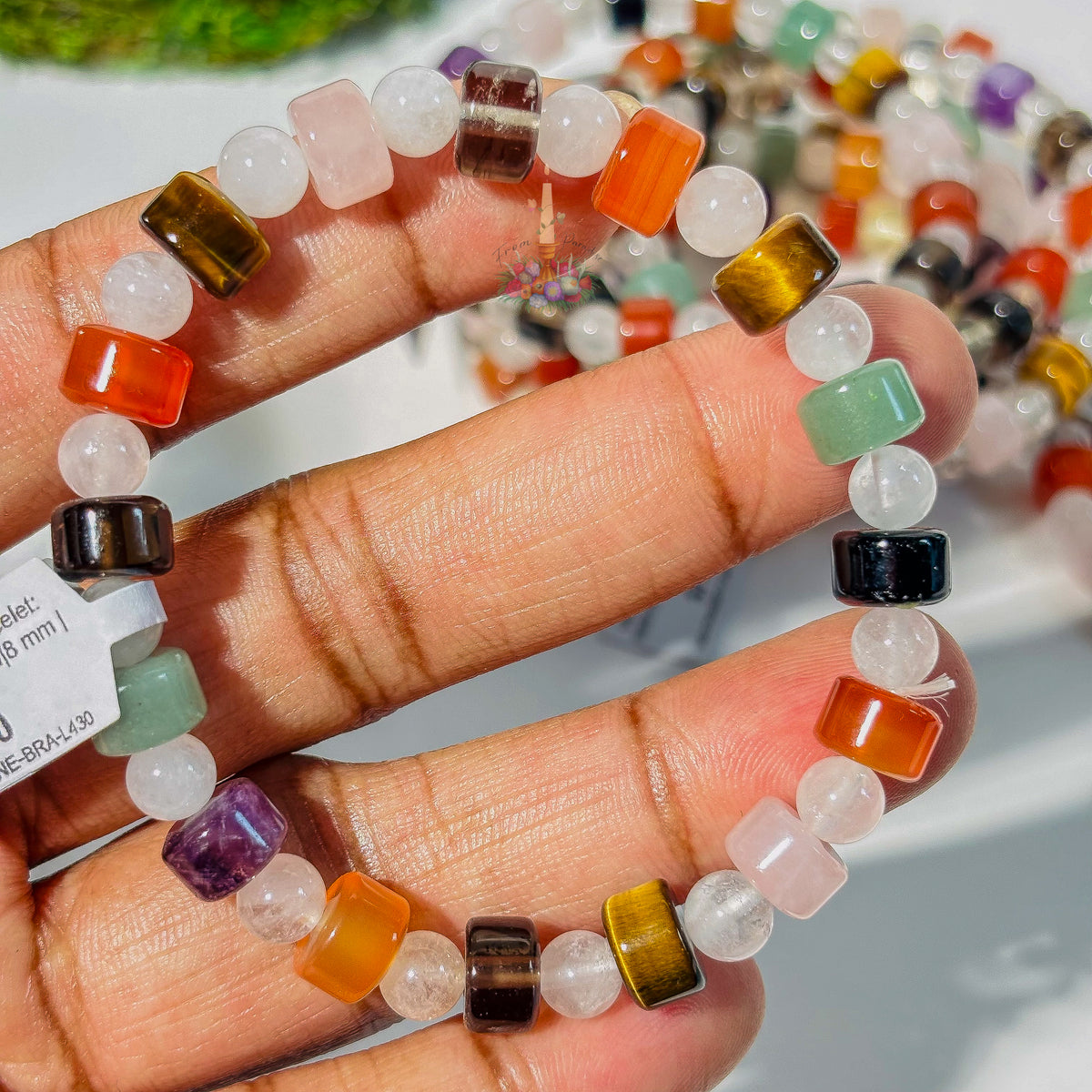 Multi-gemstone crystal bracelet with various colorful healing stones for balance and protection.