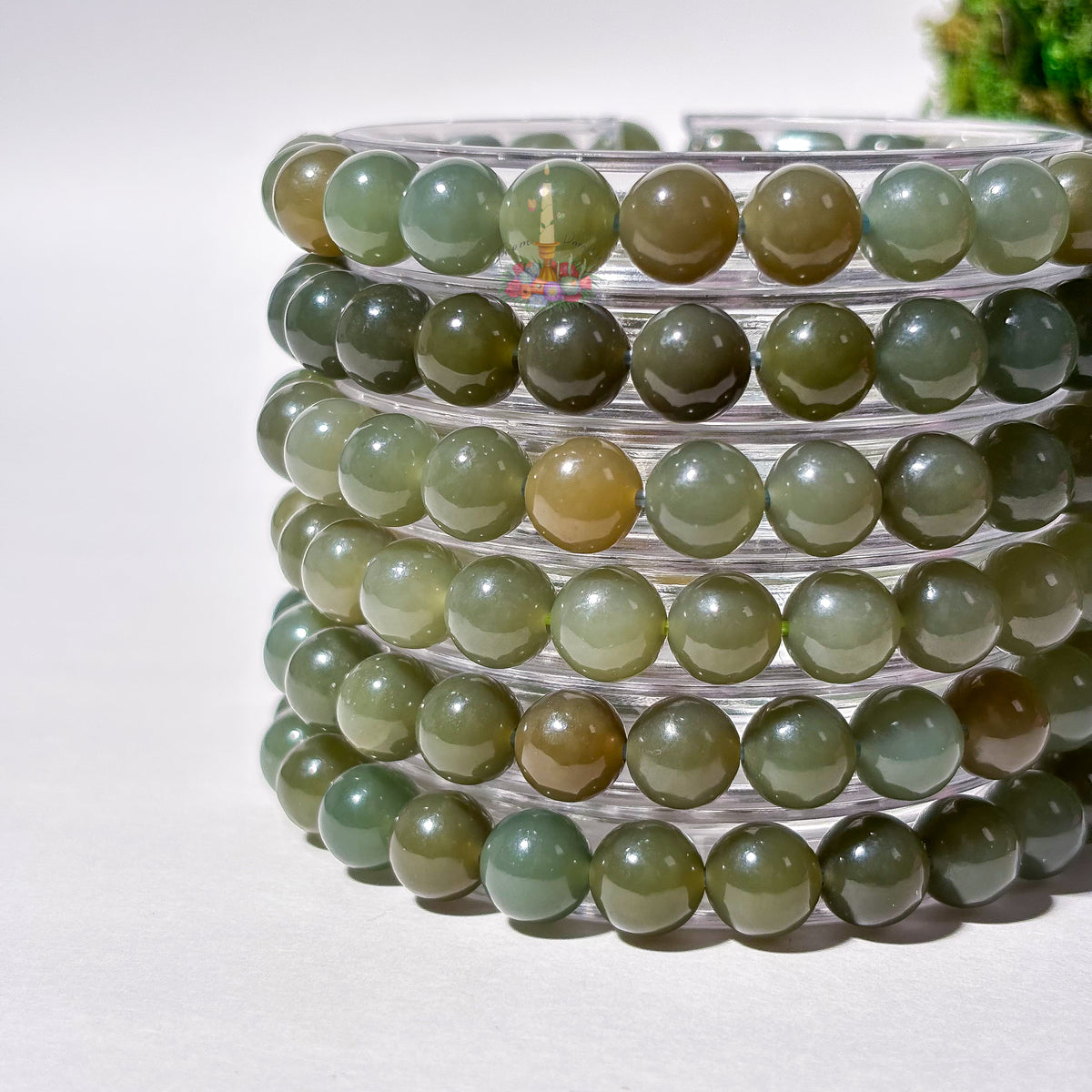 Natural green nephrite jade bead bracelet for good fortune and abundance.