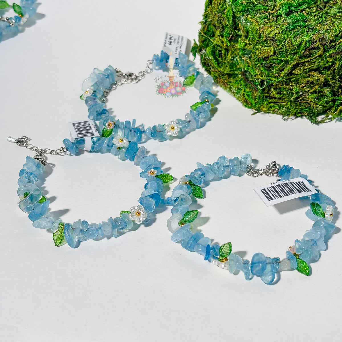 Three From Paradise Aquamarine Flower Fairy Crystal Bracelets with small floral and leaf charms.