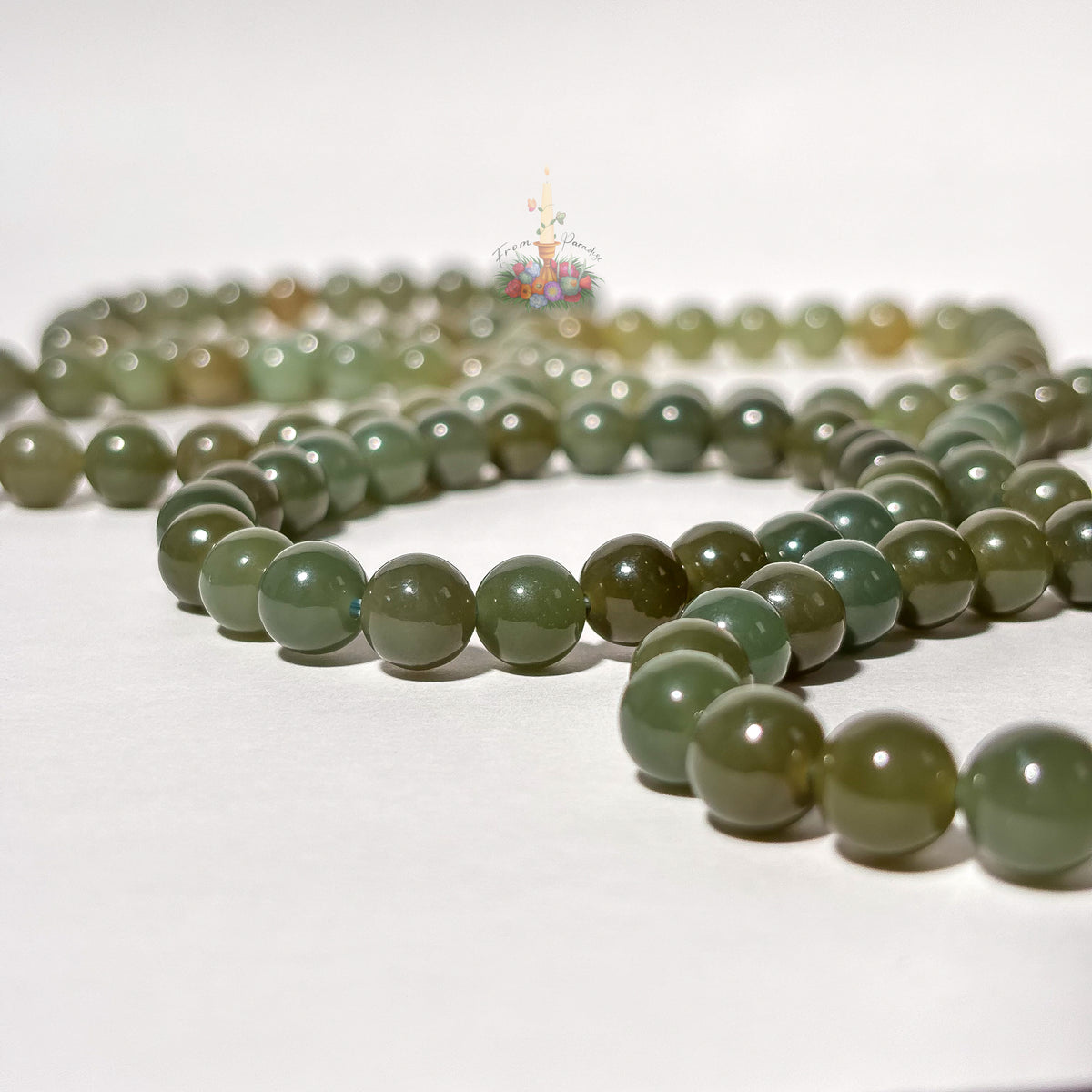 Natural green nephrite jade gemstone bead bracelet for good fortune and abundance.