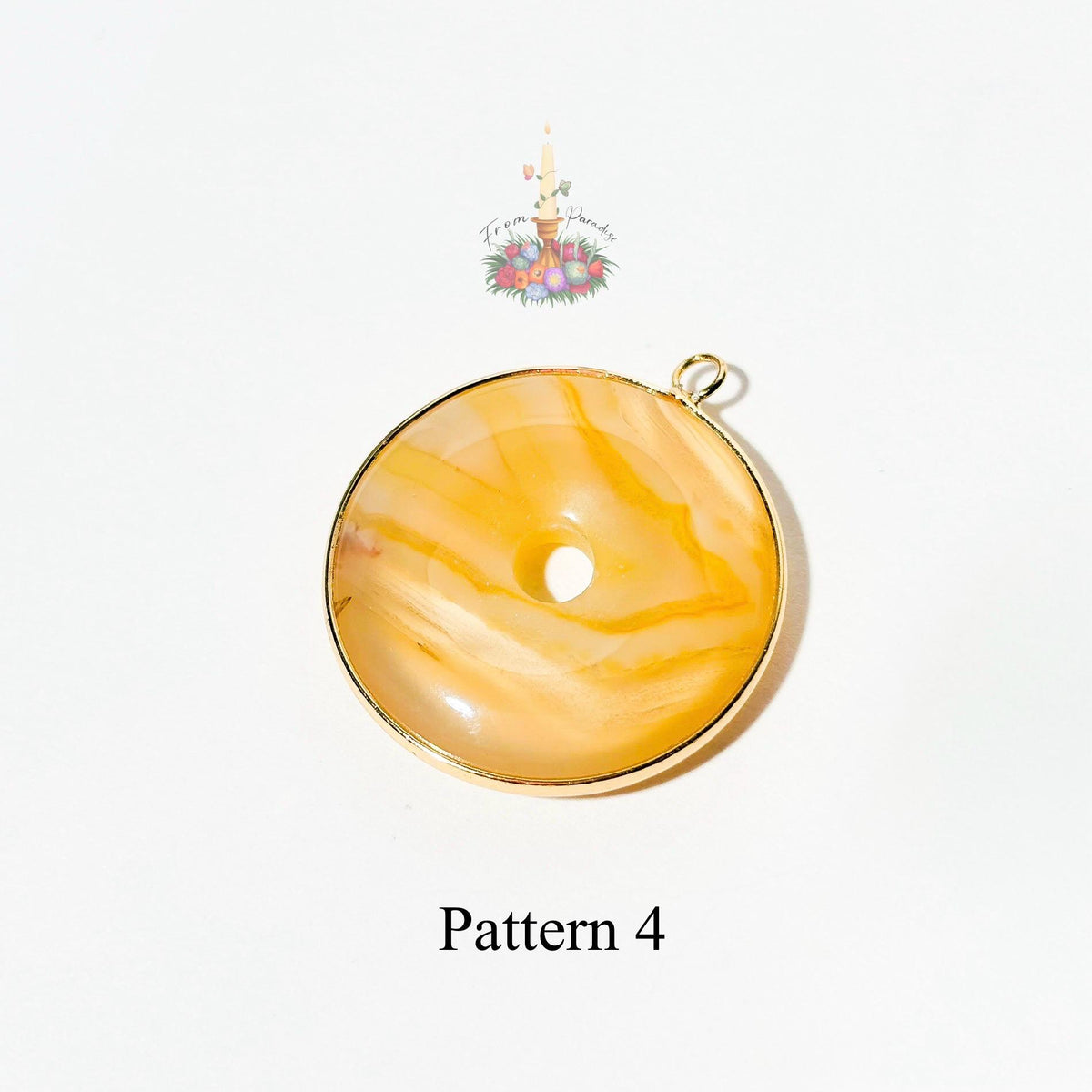 A round yellow-orange agate pendant with a gold bezel and loop, displayed on a white background with 'Pattern 4' text below and a small logo above.
