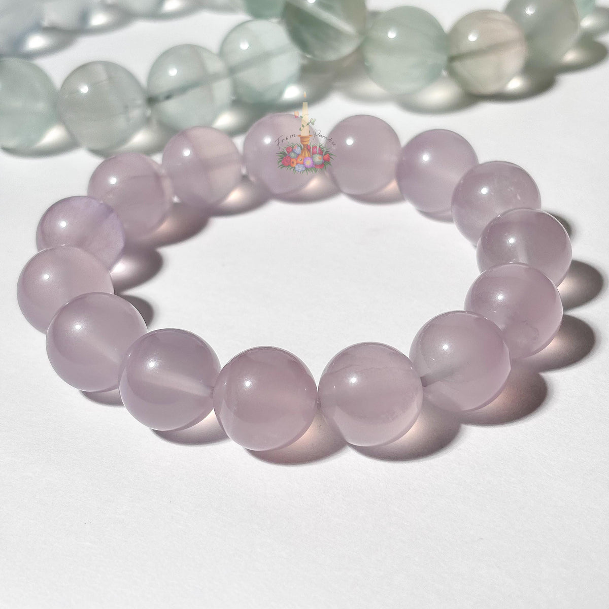 Light purple beaded bracelet on a white background
