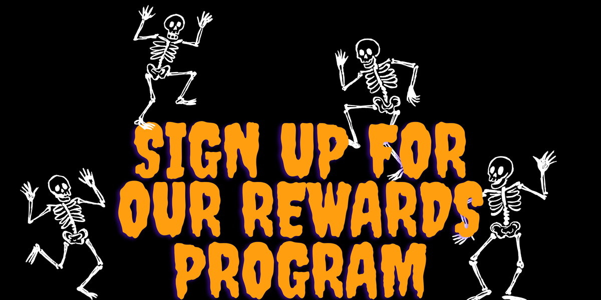 Halloween-themed graphic with the text 'SIGN UP FOR OUR REWARDS PROGRAM' in large orange letters outlined in purple, on a black background, with four white cartoon skeletons dancing around it.
