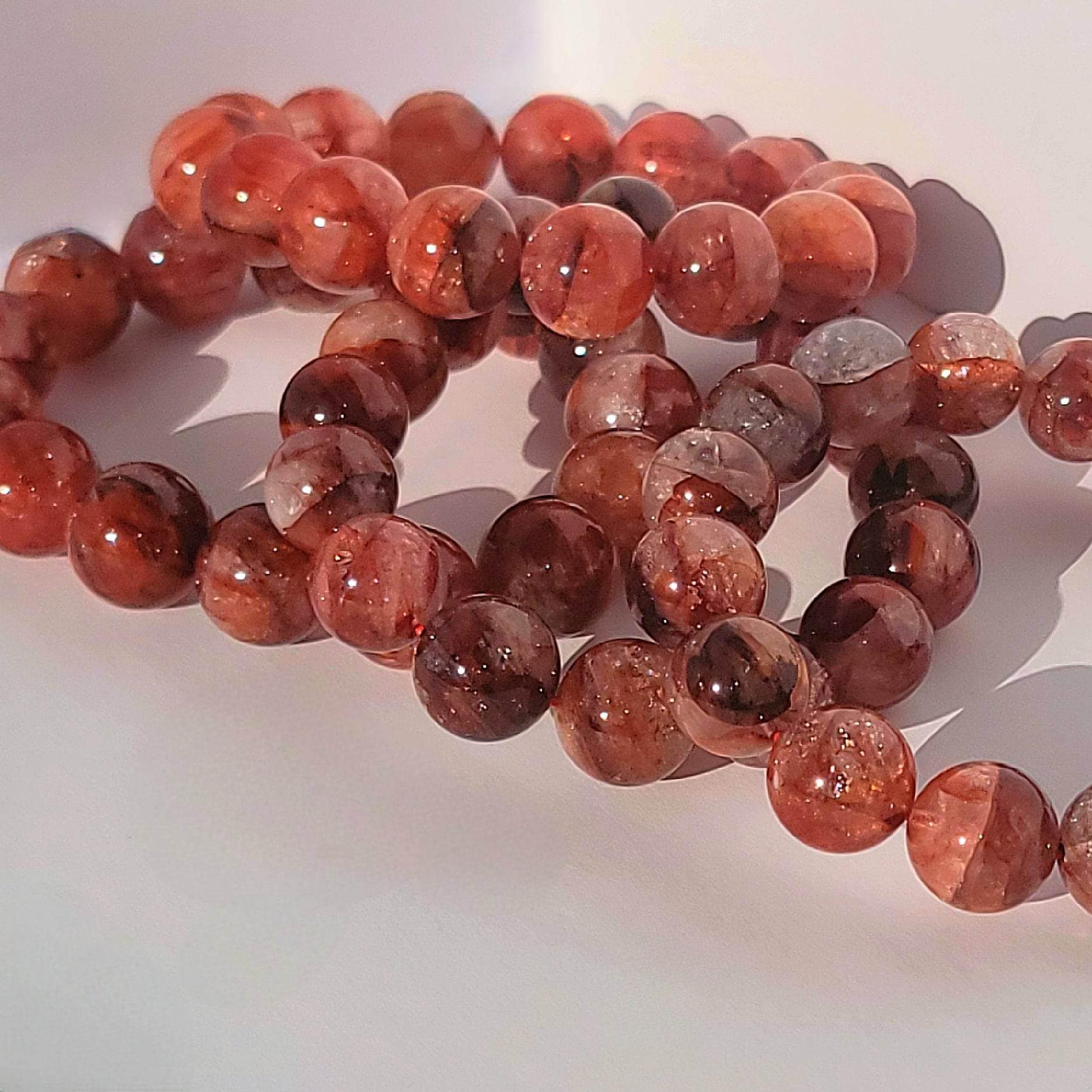 Four Beautiful Fire Quartz Beaded Bracelet with rainbow inclusions.