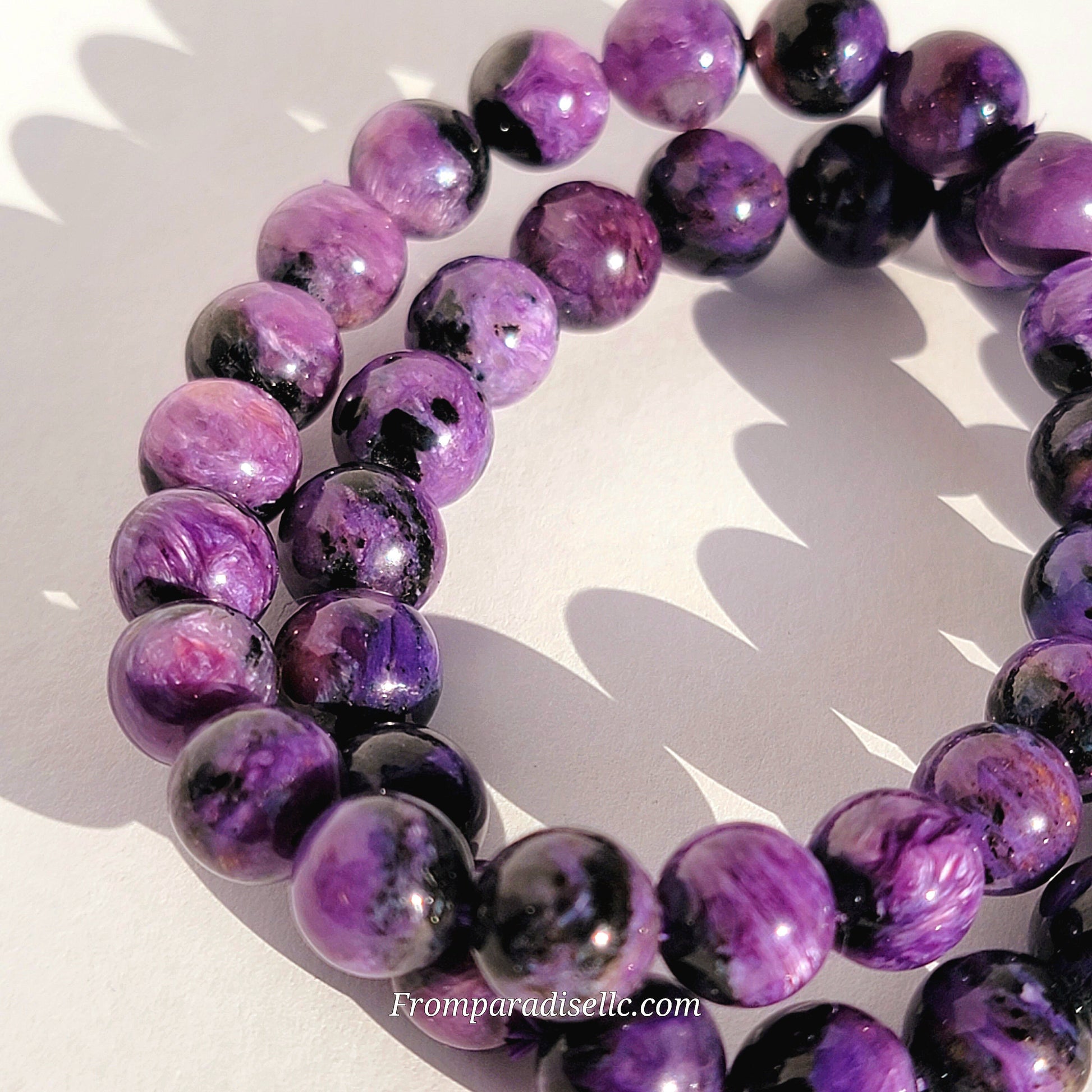 Charoite bracelet against a white background