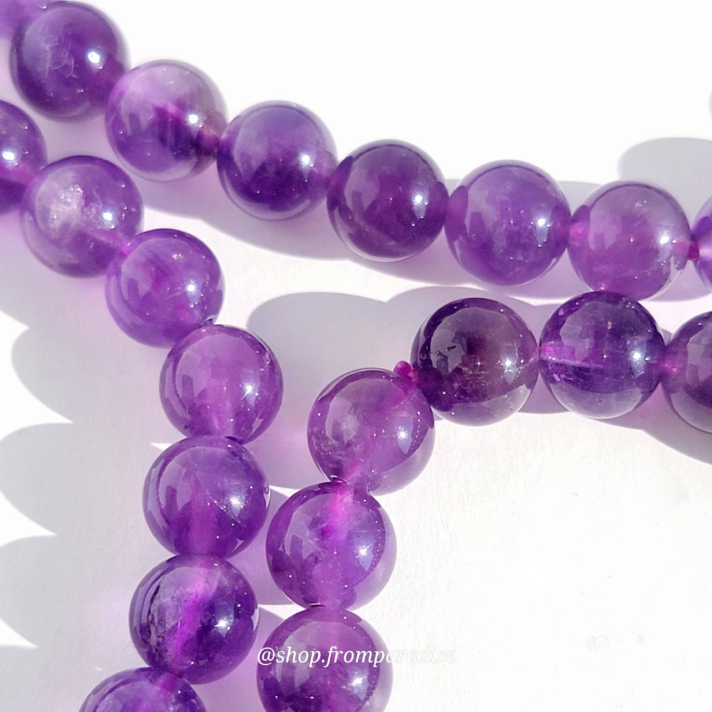 amethyst beads strung on bracelet