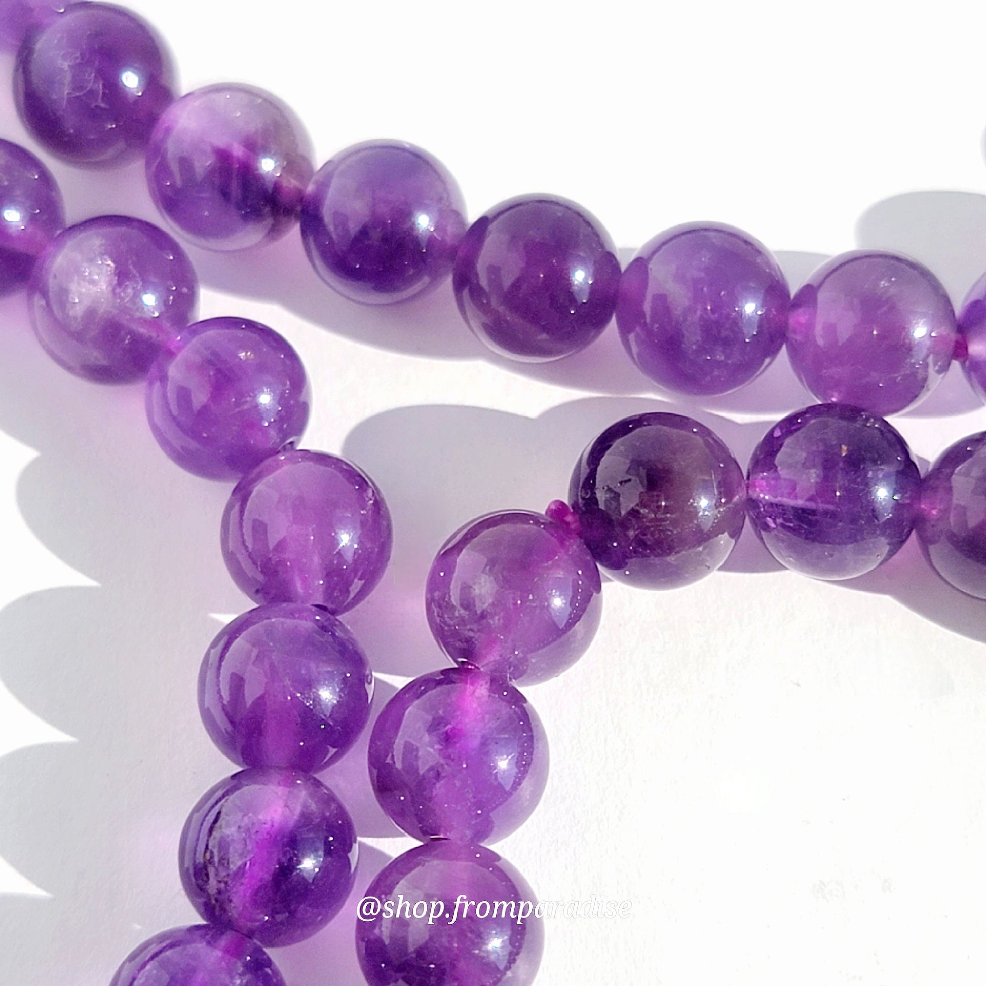 amethyst beads strung on bracelet