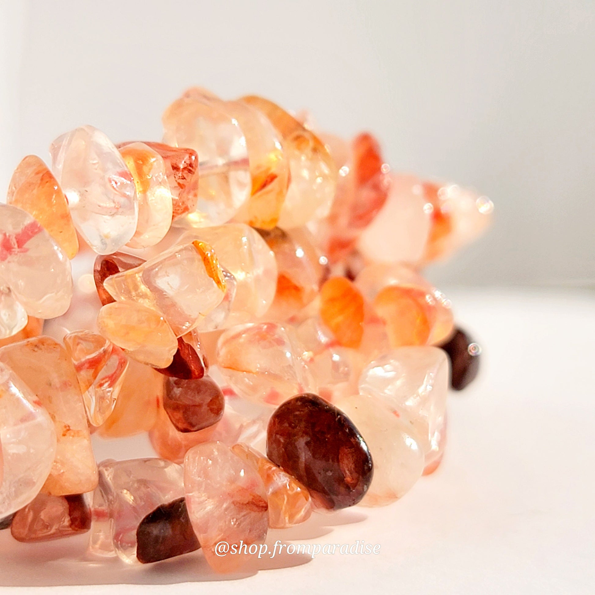 fire quartz crystal chip stretch bracelet jewelry displayed against a white background