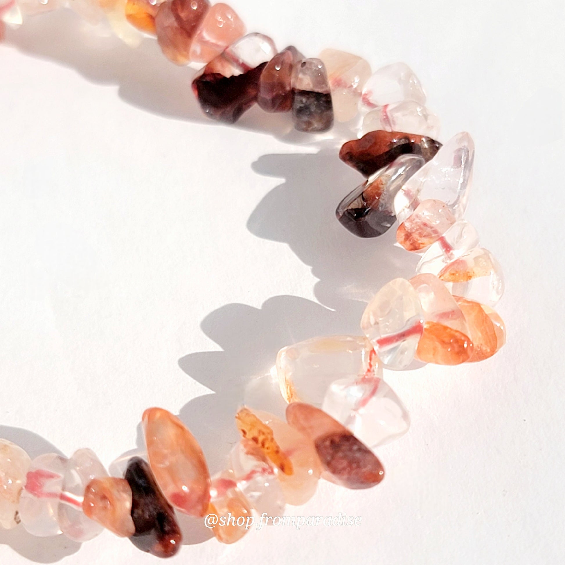 fire quartz crystal chip stretch bracelet jewelry displayed against a white background