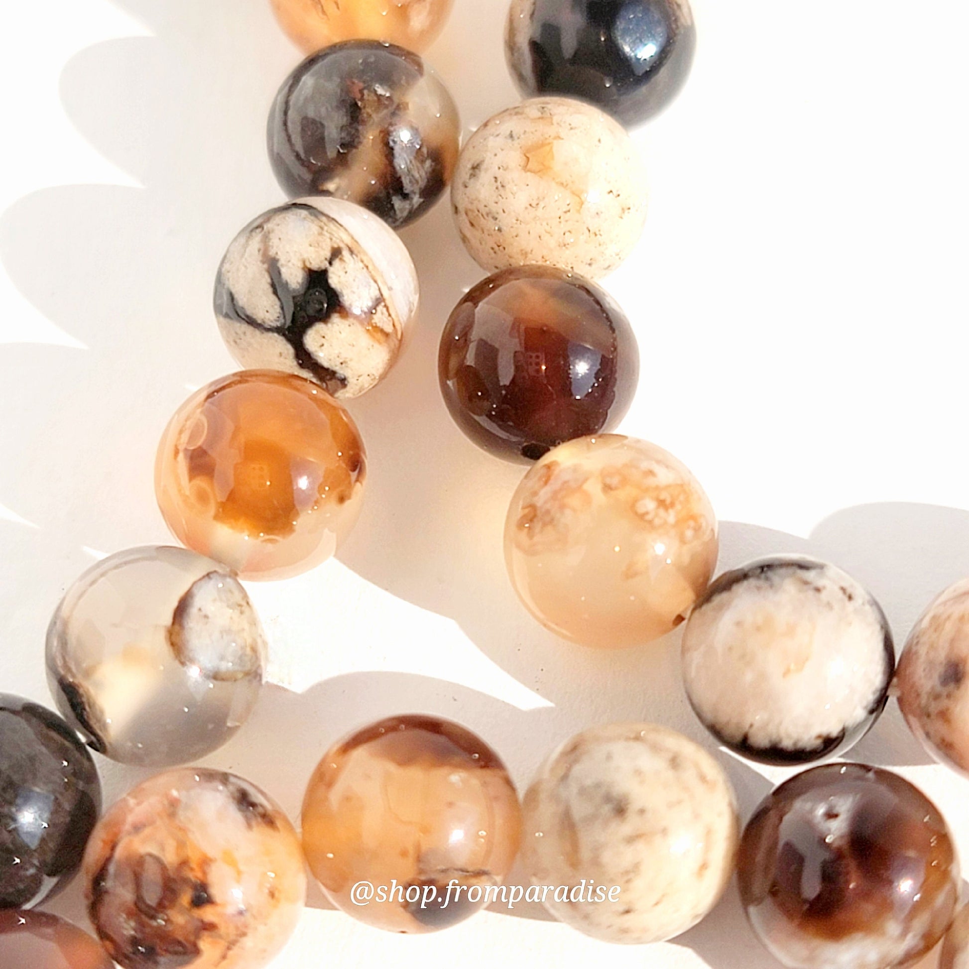 close up of black flower agate jewelry beads