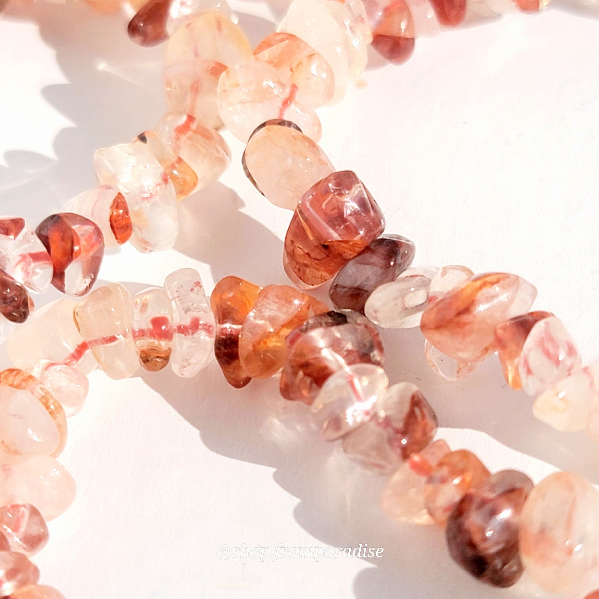 fire quartz crystal chip stretch bracelet jewelry displayed against a white background