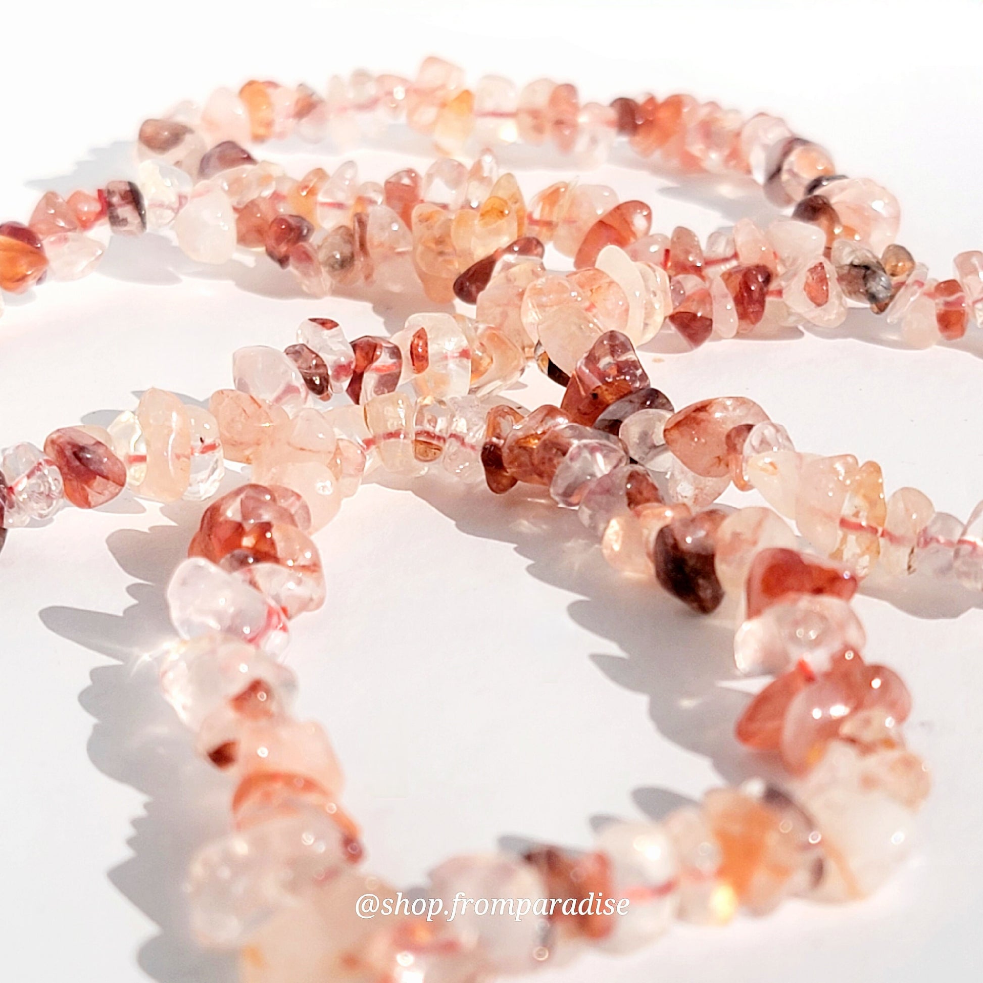 fire quartz crystal chip stretch bracelet jewelry displayed against a white background