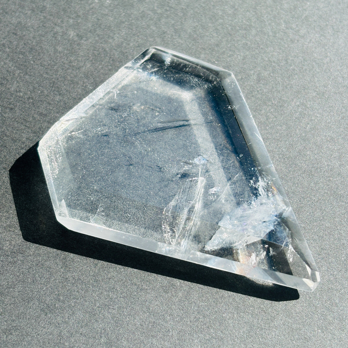 Clear Quartz Crystal Boho Chic Stone Sculpture against a black background