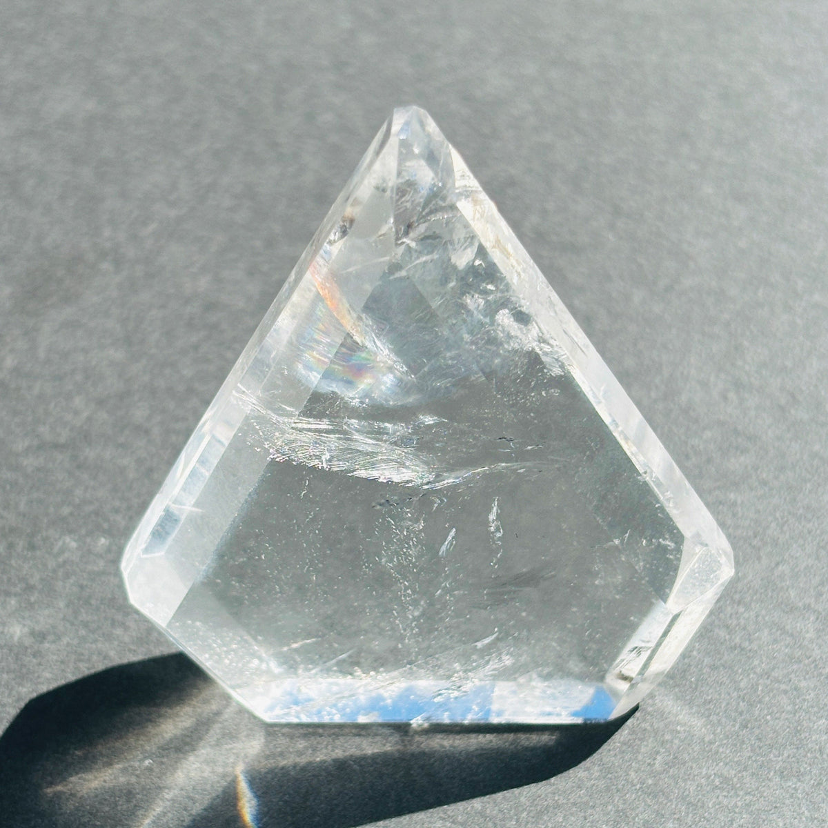 Clear Quartz Crystal Boho Chic Stone Sculpture against a black background