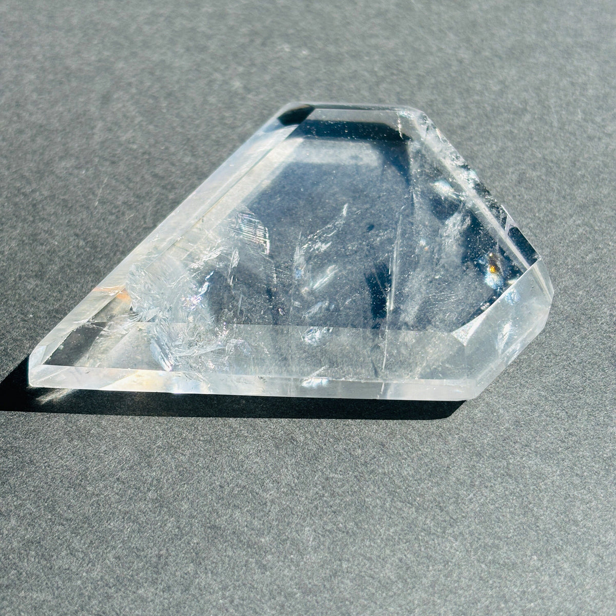 Clear Quartz Crystal Boho Chic Stone Sculpture against a black background