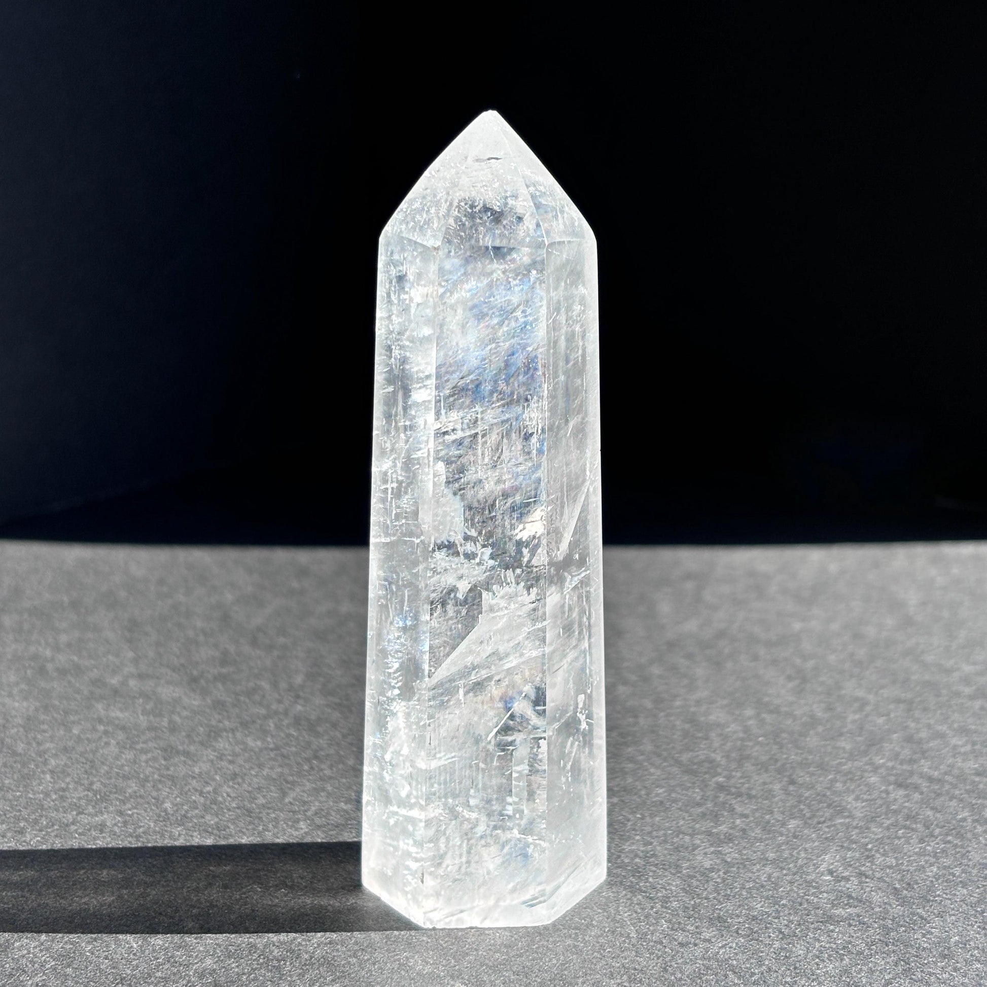 Optical Calcite Crystal Tower against a black background