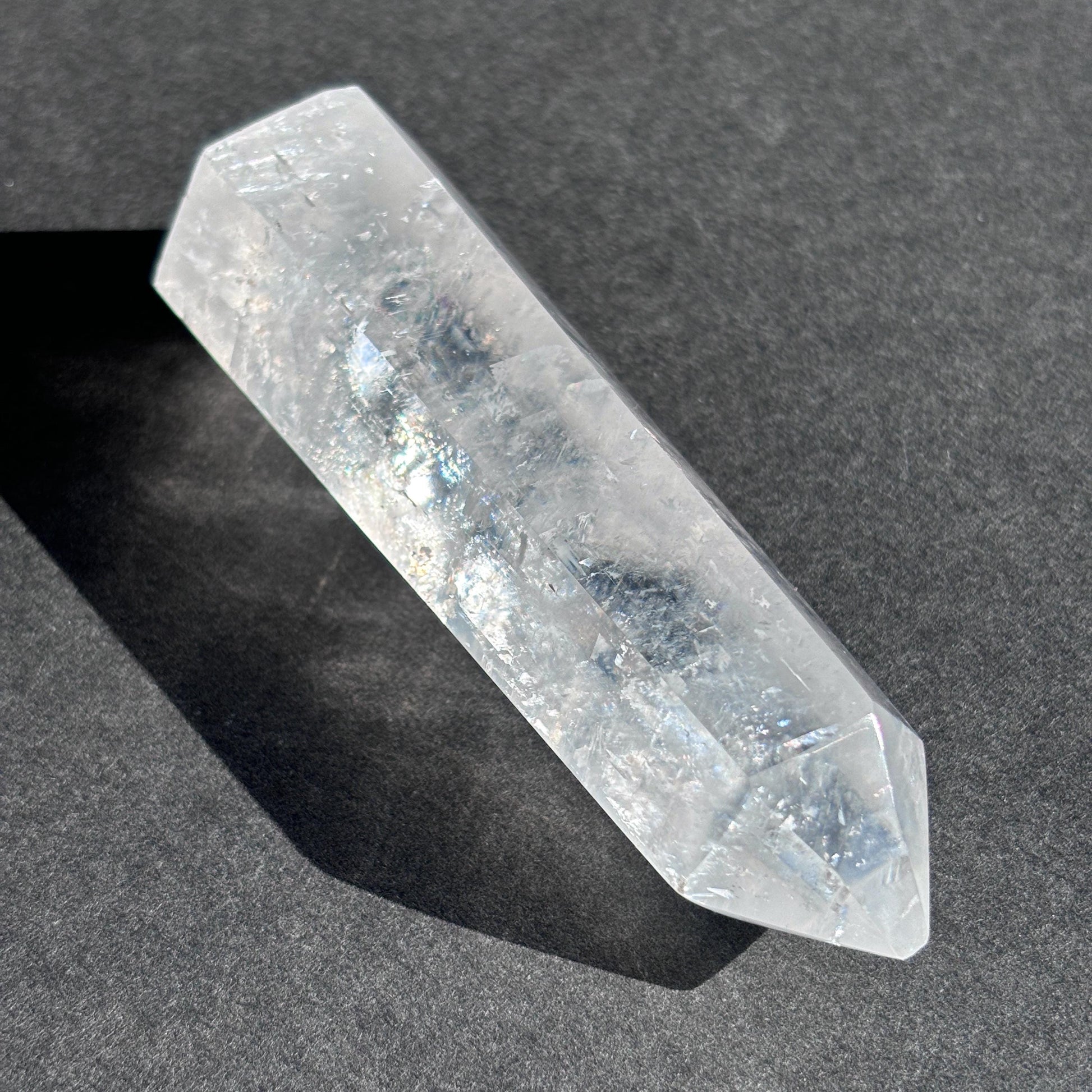 Optical Calcite Crystal Tower against a black background