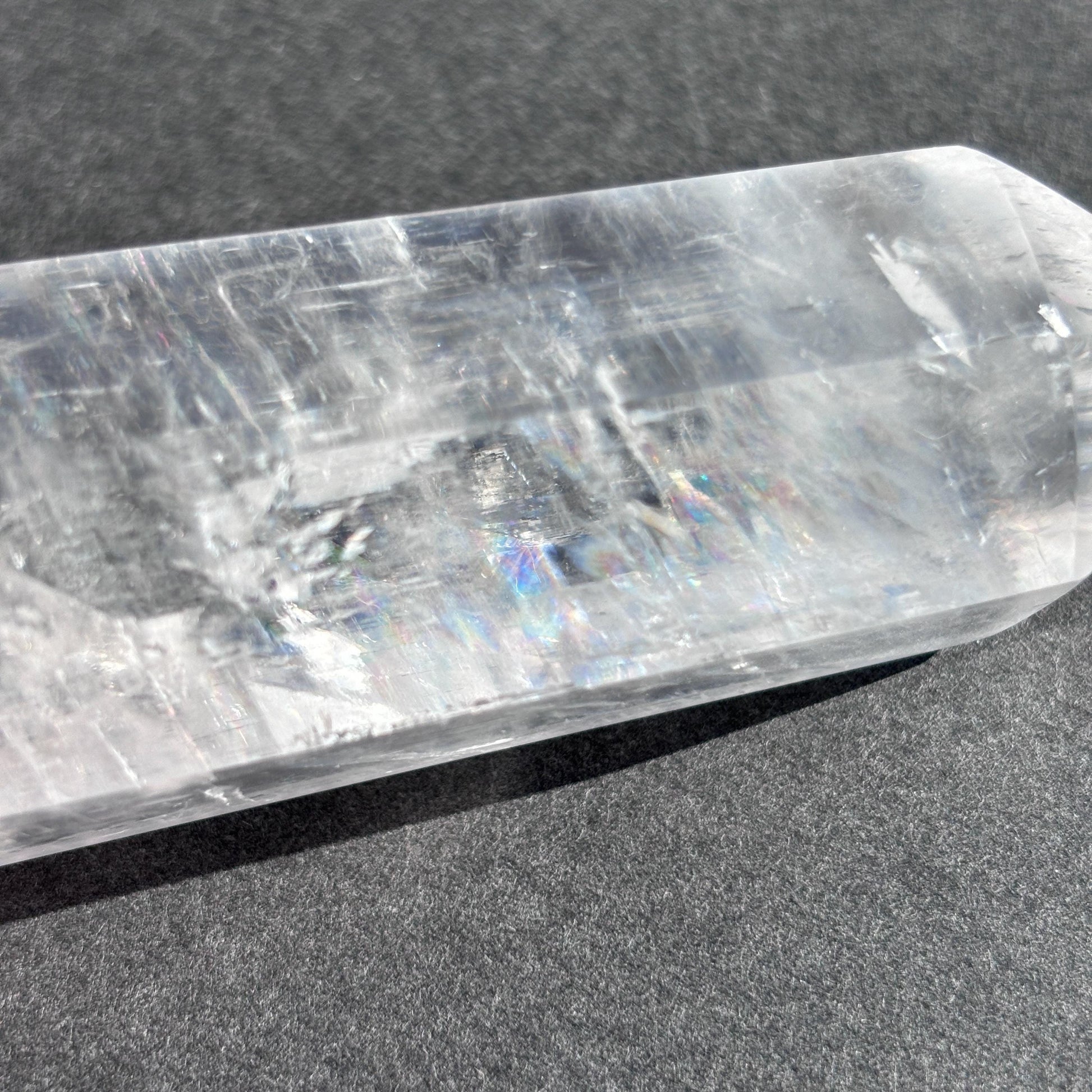 Optical Calcite Crystal Tower against a black background