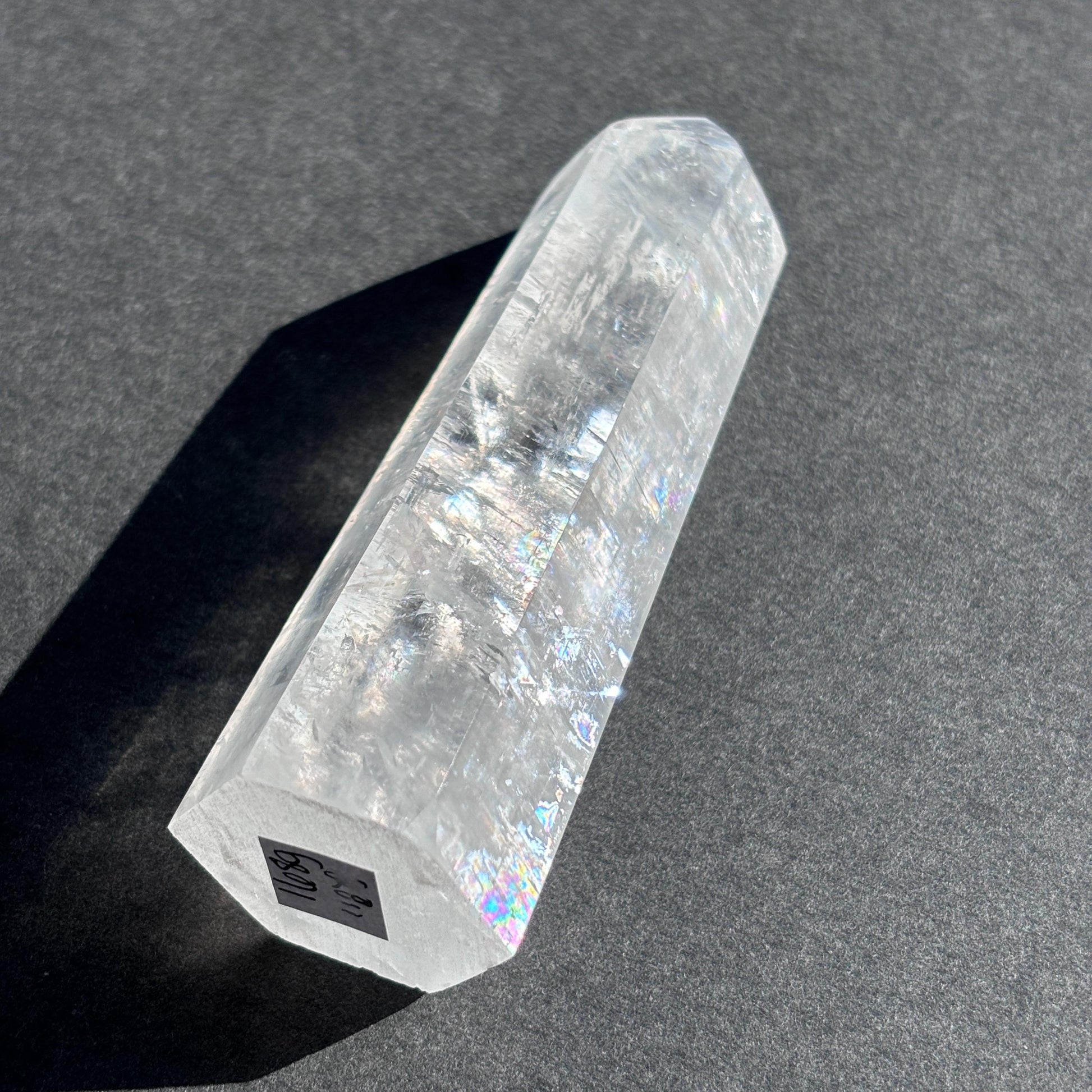 Optical Calcite Crystal Tower against a black background
