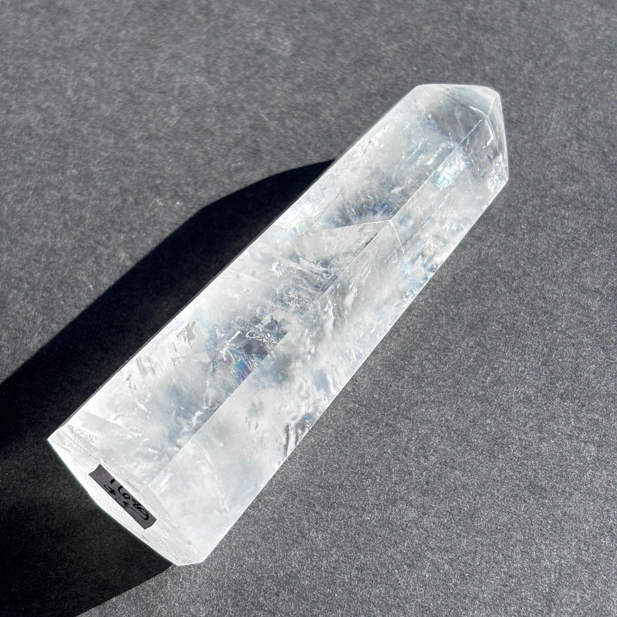 Optical Calcite Crystal Tower against a black background