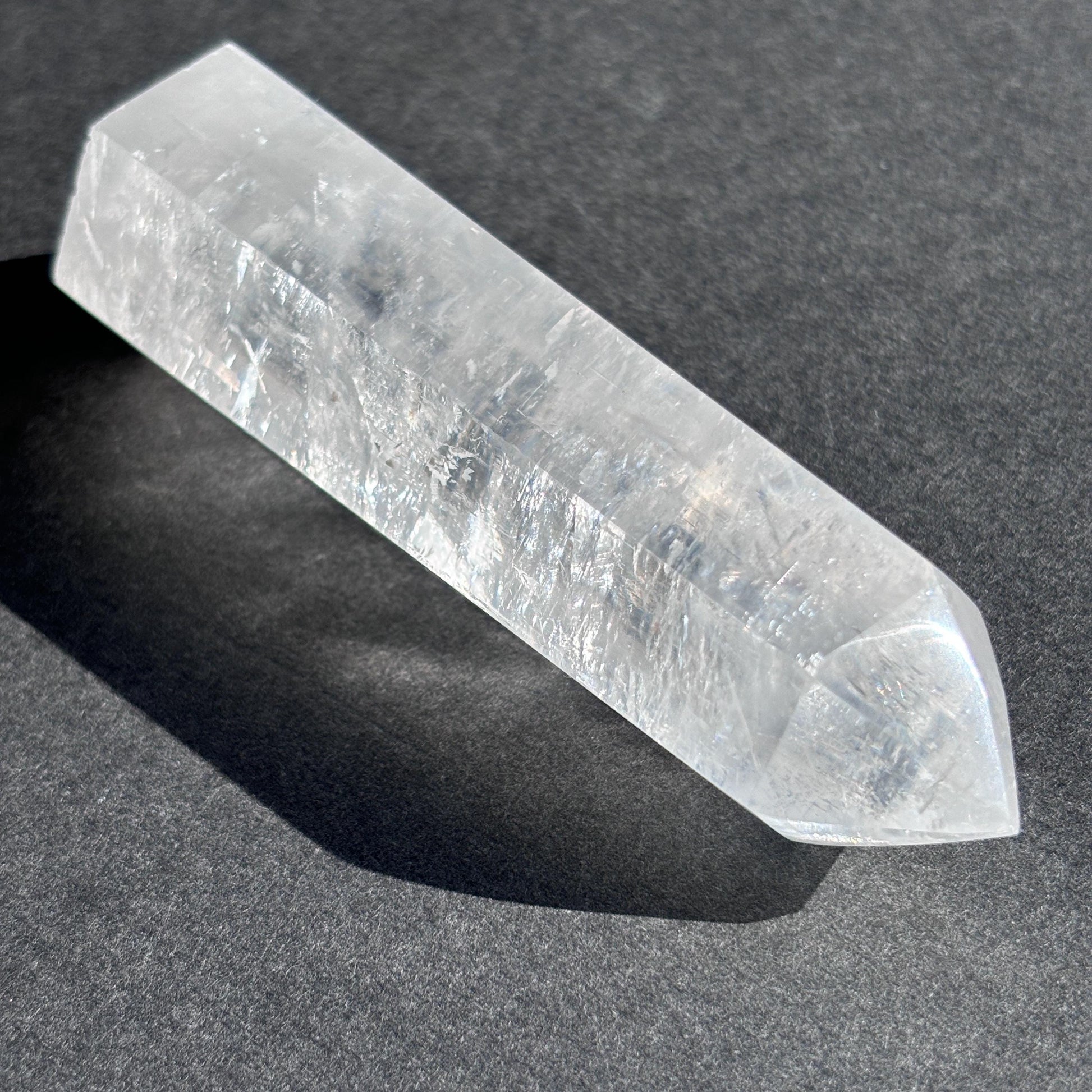 Optical Calcite Crystal Tower against a black background