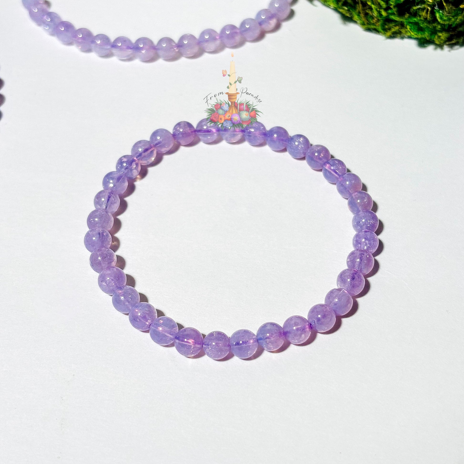one Lavender moon quartz crystal bracelet close up against white background.